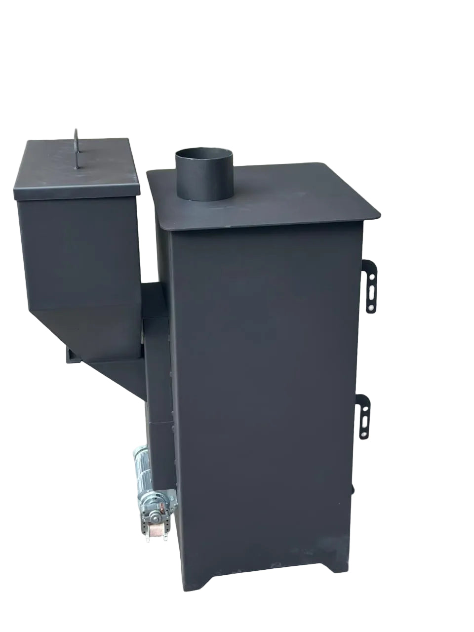 A black metal outdoor waste or composting container with a slotted lid, side hopper, and cylindrical top opening, photographed on a concrete floor.